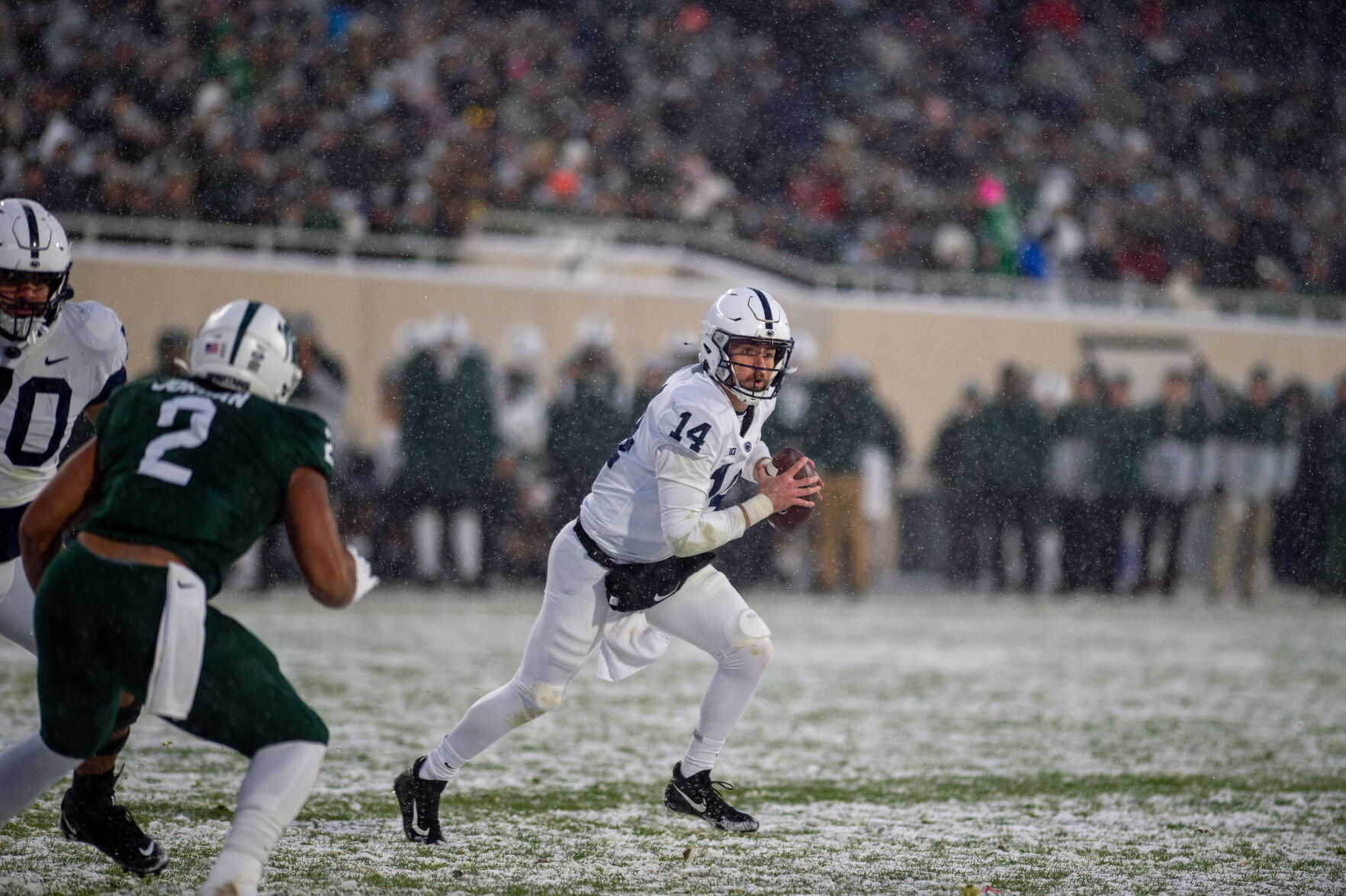 Sean Clifford (14) carries ball at Michigan State game